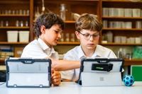 Description: Two boys on Surface Pros